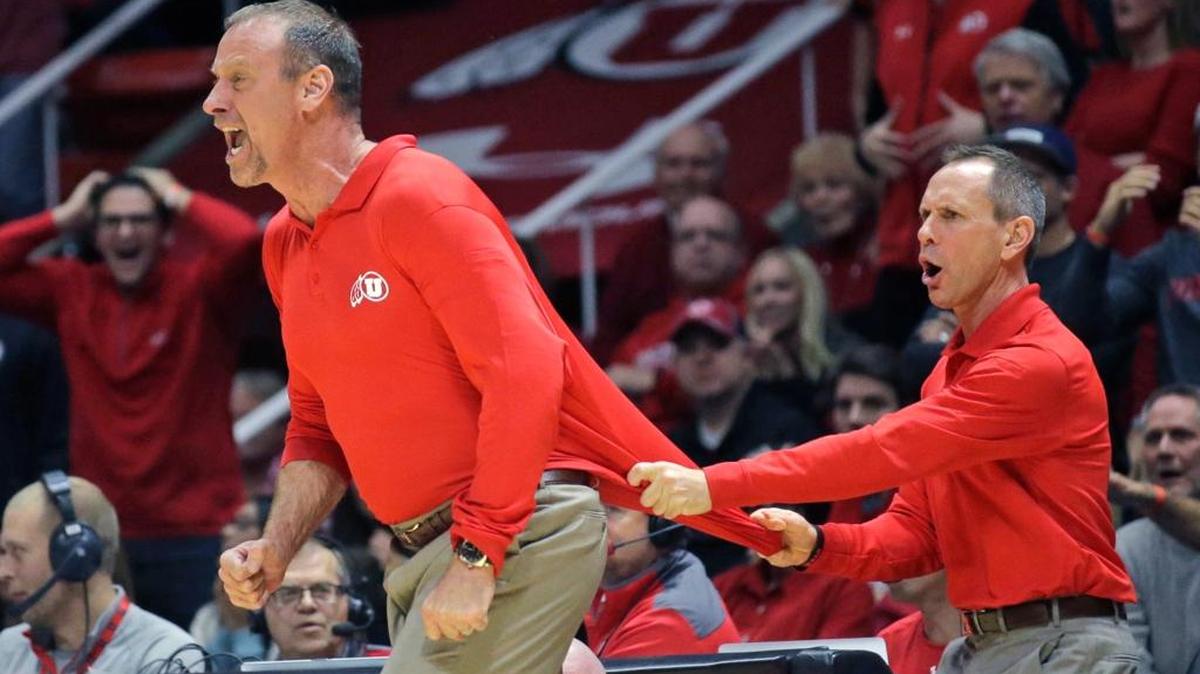 Utah coach Larry Krystkowiak, left, is restrained by associate coach Tommy Connor after a non-call on what Krystkowiak thought was a foul, during the second half of Utah’s 83-82 loss to UCLA on Saturday, Jan. 14, 2017, in Salt Lake City.
