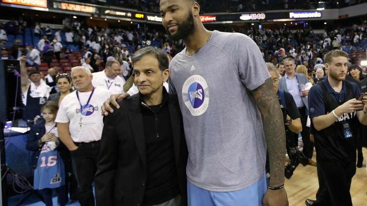 In this April 9, 2016, file photo, Vivek Ranadive, the majority owner of the Sacramento Kings poses for a photo with Kings center DeMarcus Cousins after the Kings defeated the Oklahoma City Thunder 114-112 in an NBA basketball game in Sacramento, Calif. The Kings reportedly agreed to trade Cousins to the New Orleans Pelicans on Sunday night.