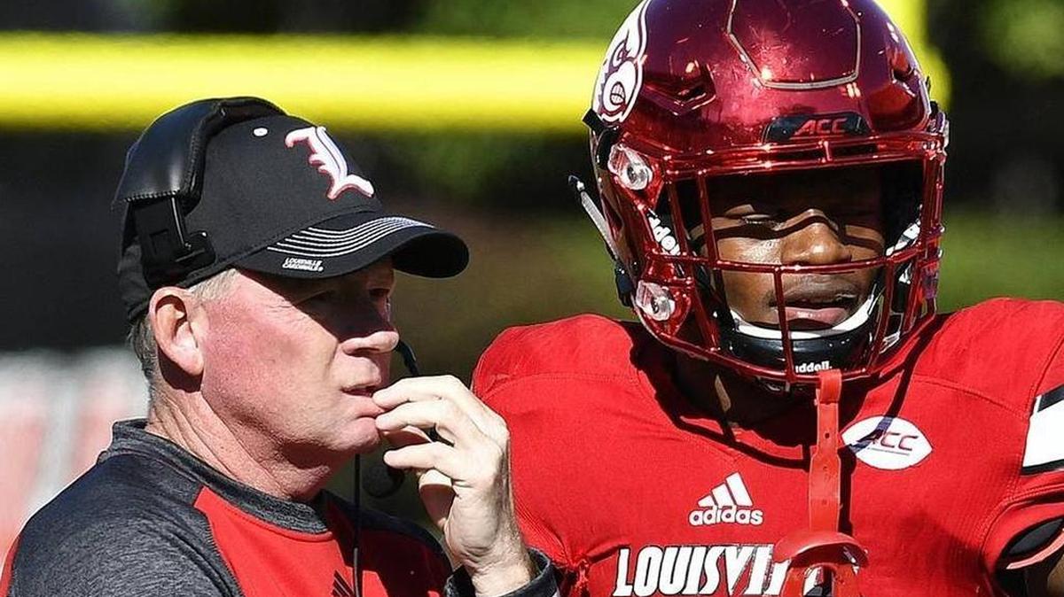 Louisville head football coach Bobby Petrino with Heisman Trophy winning quarterback Lamar Jackson. The school admitted Wednesday it received information about Wake Forest’s game plan before a game this season.