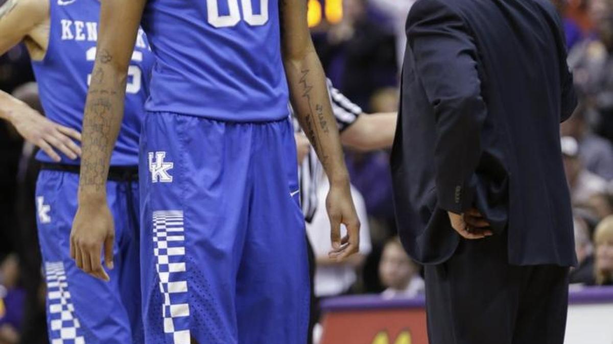 Kentucky forward Marcus Lee (00) talked with Kentucky head coach John Calipari after he fouled out in the second half of the Kentucky at LSU basketball game at Pete Maravich Assembly Center in Baton Rogue, La.,, on Jan. 5, 2016. LSU beat UK 85-67