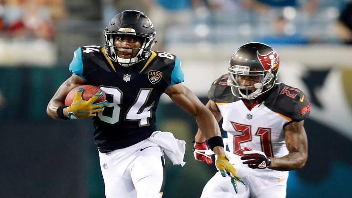 Jacksonville Jaguars punt returner Keelan Cole (84) gets past Tampa Bay Buccaneers defenders Alan Cross (45) and Justin Evans (21) during the first half of Tampa Bay’s 12-8 win in an NFL preseason football game, Thursday, Aug. 17, 2017, in Jacksonville, Fla.