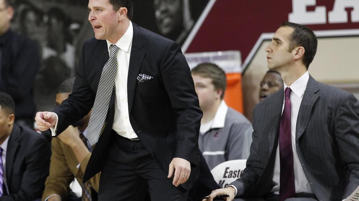 Former UK student manager and current EKU head coach Dan McHale, left, coached his team with assistant Michael Bradley as EKU defeated Manhattan 76-64 on Tuesday December 29, 2015 in Richmond, Ky. McHale’s Colonels play at Morehead State on Thursday night in game televised by the CBS Sports Network.