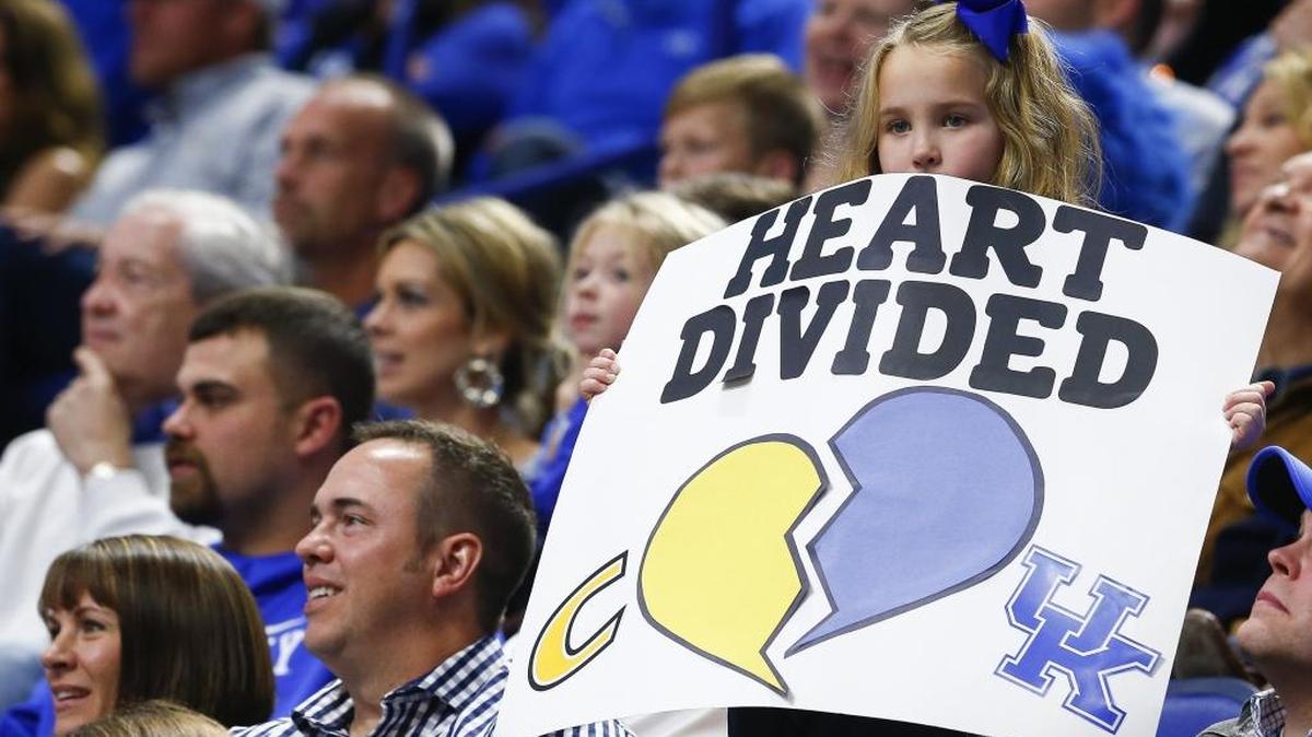 A young fan cheers for both teams during an exhibition game between Kentucky and Centre College at Rupp Arena in Lexington, Ky., Friday, Nov. 3, 2017. Kentucky beat Centre College 106-63. The Cats open the regular season on Friday, Nov. 10 against Utah Valley.