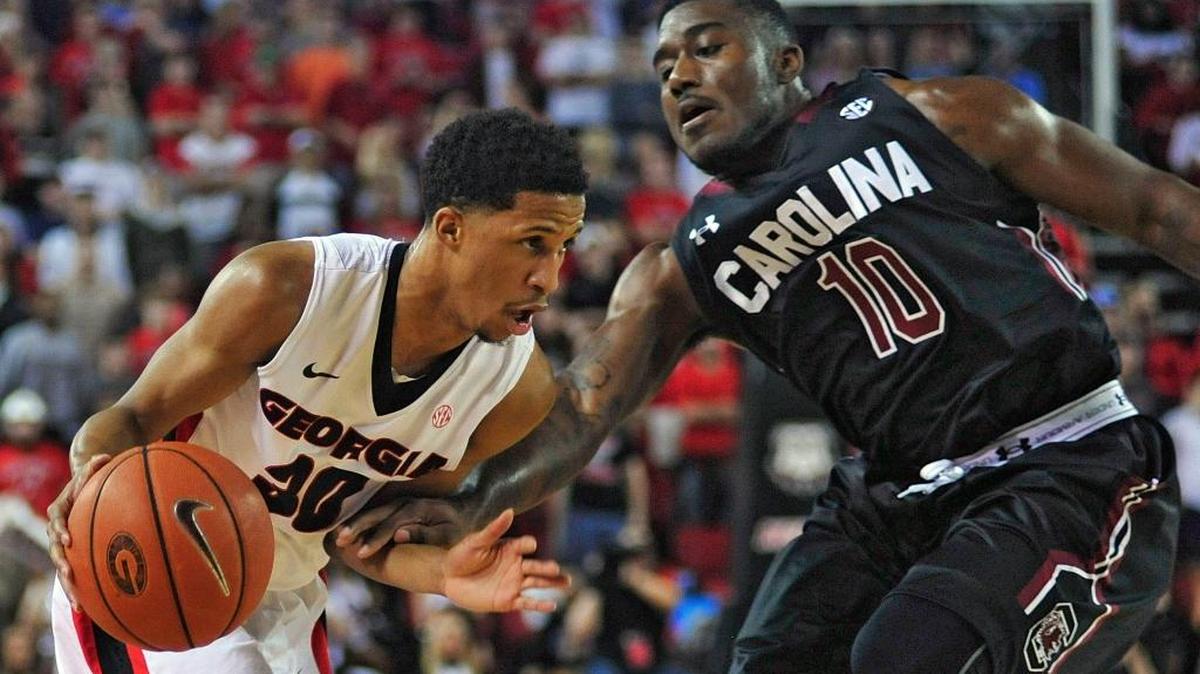 South Carolina guard Duane Notice (10) pressures Georgia guard J.J. Frazier (30) during an NCAA college basketball game Tuesday, Feb. 2, 2016, in Athens, Ga.