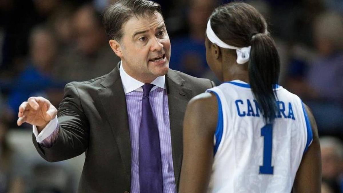 Kentucky Coach Matthew Mitchell, left, talked with forward Batouly Camara before the second half began against Tennessee on Monday, Jan. 25, 2016, in Memorial Coliseum in Lexington.
