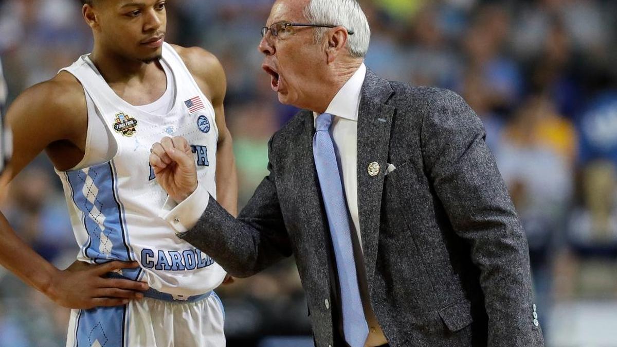 North Carolina head coach Roy Williams, right talks to Nate Britt during the second half of the Tar Heels’ win over Oregon in the semifinals of the Final Four NCAA college basketball tournament on Saturday, April 1, 2017, in Glendale, Ariz.