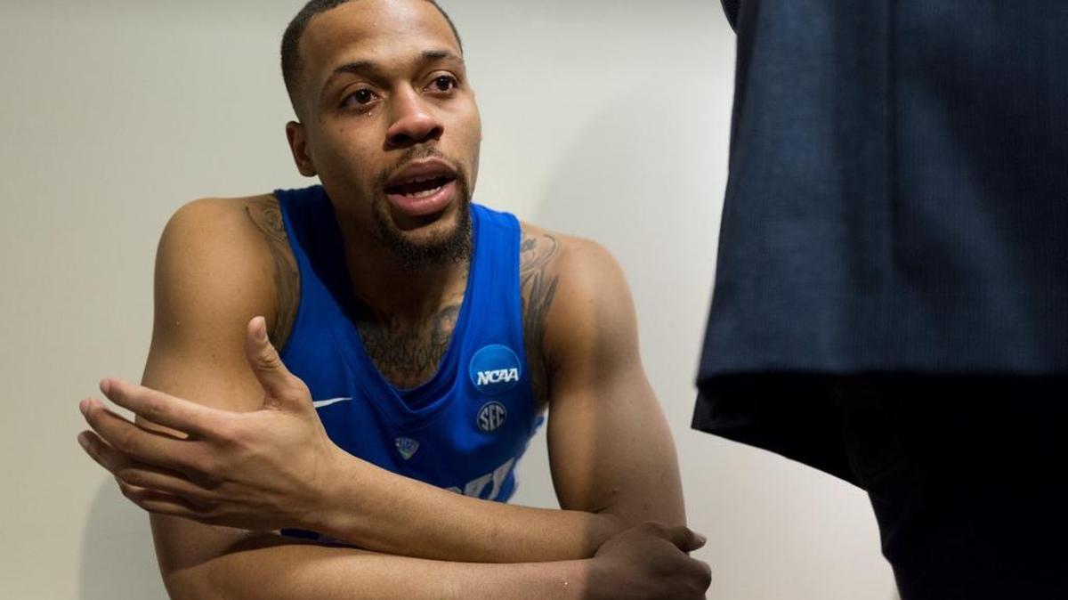 A tearful Isaiah Briscoe pleads with photographers to stop taking his photo after Kentucky’s loss to North Carolina 75-73 in the South Regional final on Sunday, March 26, 2017 at FedExForum in Memphis.