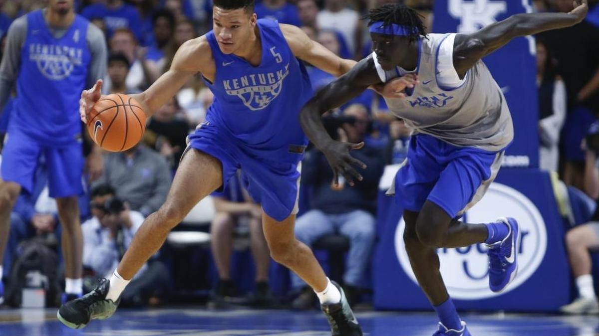 Kentucky freshman forward Kevin Knox (5) steals the ball from sophomore forward Wenyen Gabriel (32) during the Blue/White game at Rupp Arena in Lexington, Ky., on October 20, 2017.
