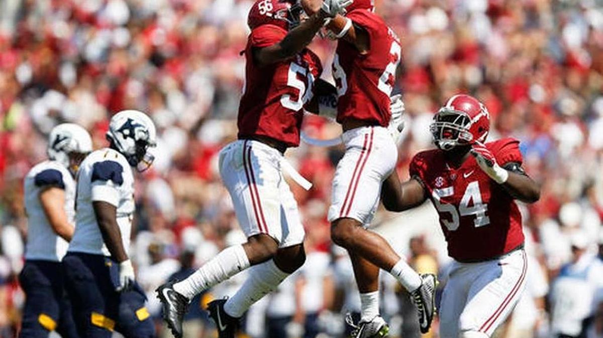 Alabama linebacker Tim Williams, left, defensive back Minkah Fitzpatrick, center, and defensive lineman Dalvin Tomlinson celebrate after Fitzpatrick sacked Kent State quarterback Mylik Mitchell during Alabama’s 48-0 win over Kent State last week.